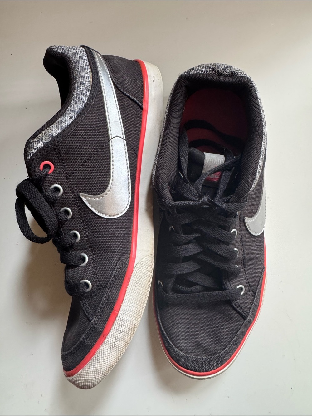Nike Black Sneakers with Silver Swoosh and Red-Orange Trim